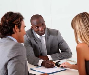 Woman discussing with loan advisors